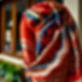 A beautifully draped scarf showcasing intricate patterns and vibrant colors.