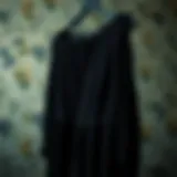 Timeless Elegance in Black Elegant black dress hanging on a vintage hanger