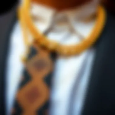 Close-up of a stylish tie and sophisticated gold necklace