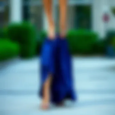 Sophisticated blue dress matched with metallic silver sandals