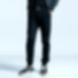 Stylish black jogger pants on a minimalist background