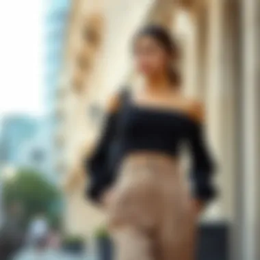 Chic black thick strap crop styled with high-waisted trousers