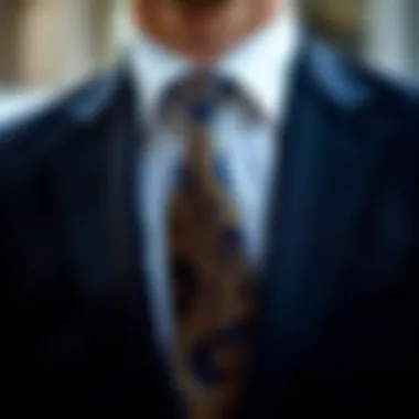 Black suit complemented by a patterned silk tie